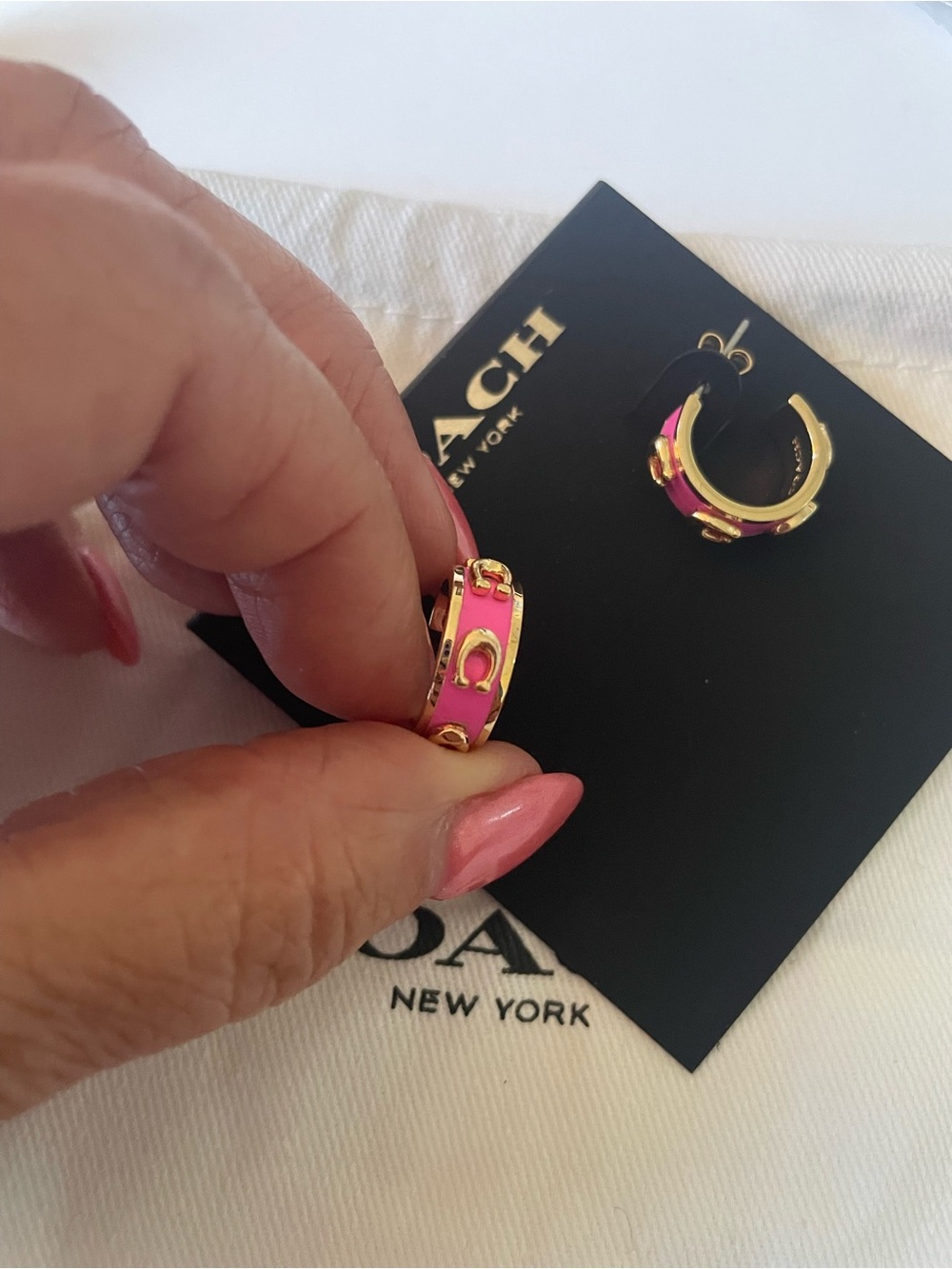 Coach Gold-Tone Mini Hoop Earrings with Pink Enamel Accents - Picture 3 of 4